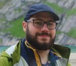 Dr Daniele Zagalia wearing a cap and smiling